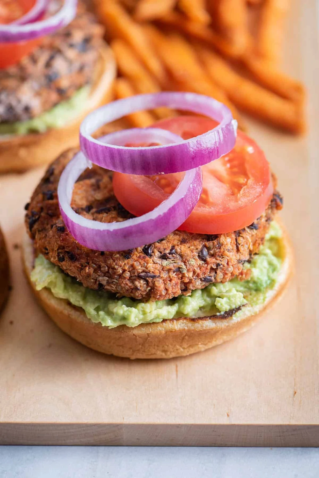 A Barny's chickpea and mushroom burger with pickled onion and herb sauce